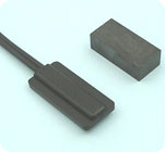 Adhesive magnetic switch and magnet